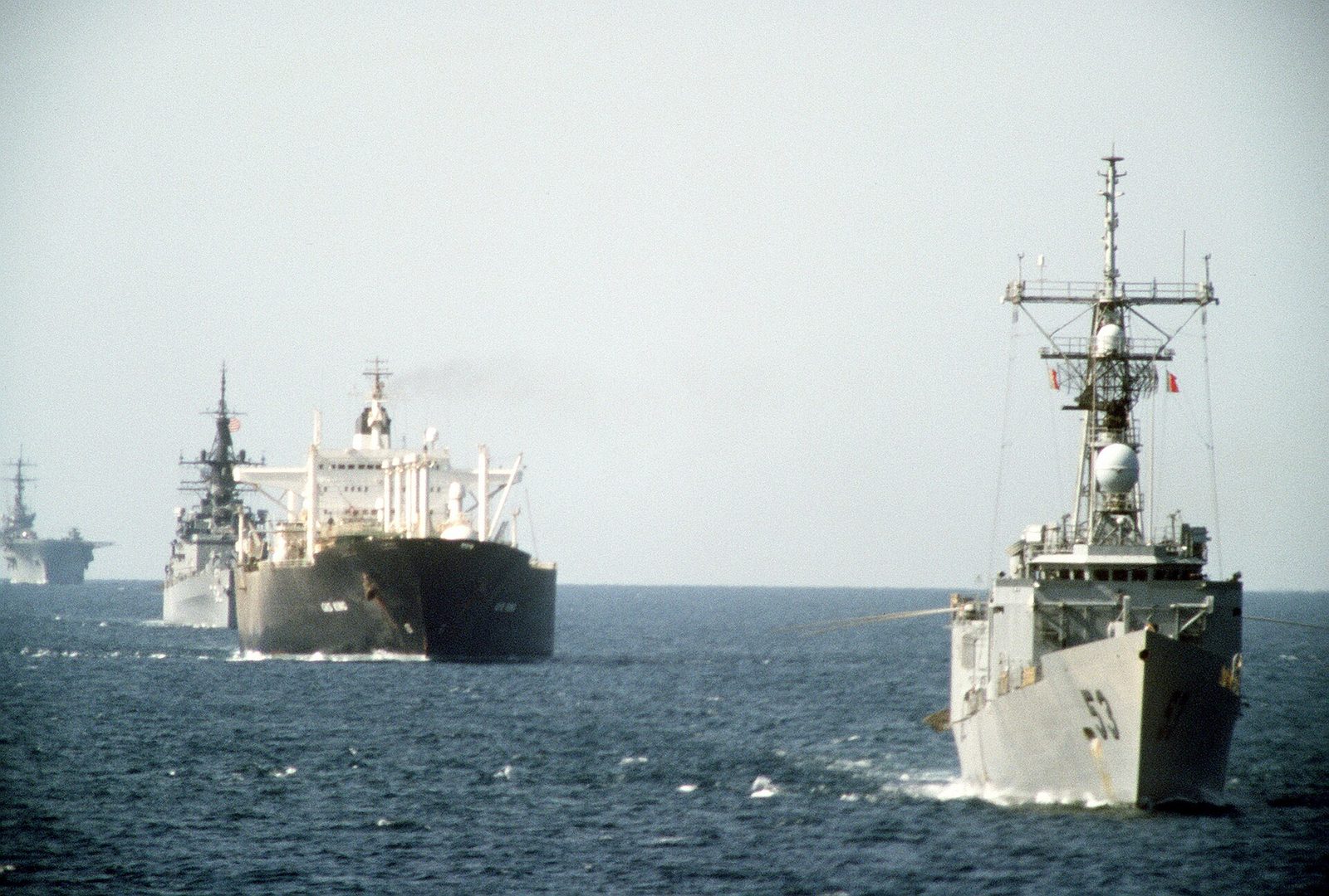 The last time. USS Hawes, the tanker Gas King, USS William H. Standley and USS Guadalcanal in convoy in the Persian Gulf, 21 October 1987, during Operation Earnest Will — the US Navy escorting refl…